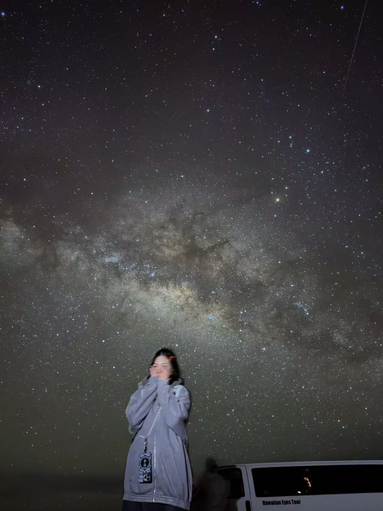 A guest posing beneath a sky full of stars