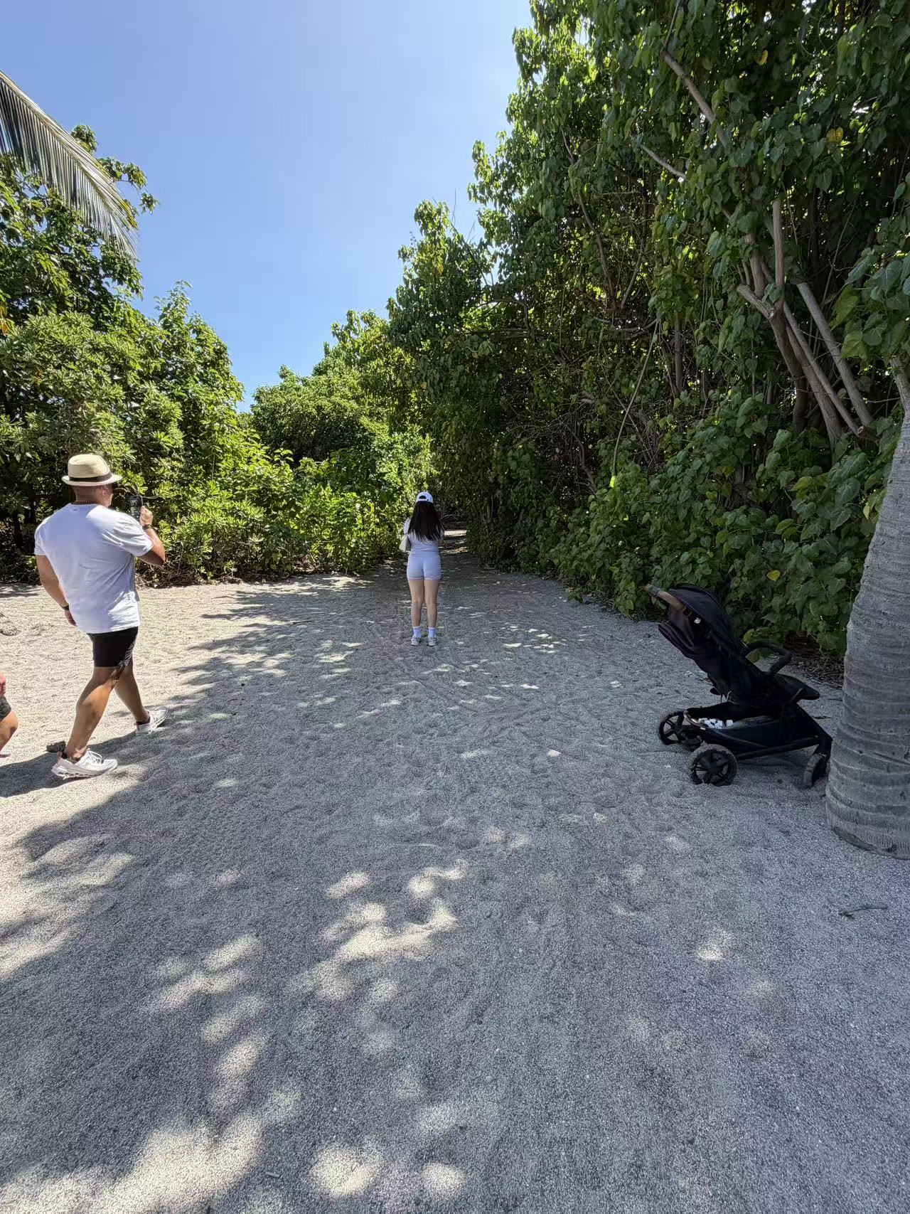 A guest walking toward the turtle beach