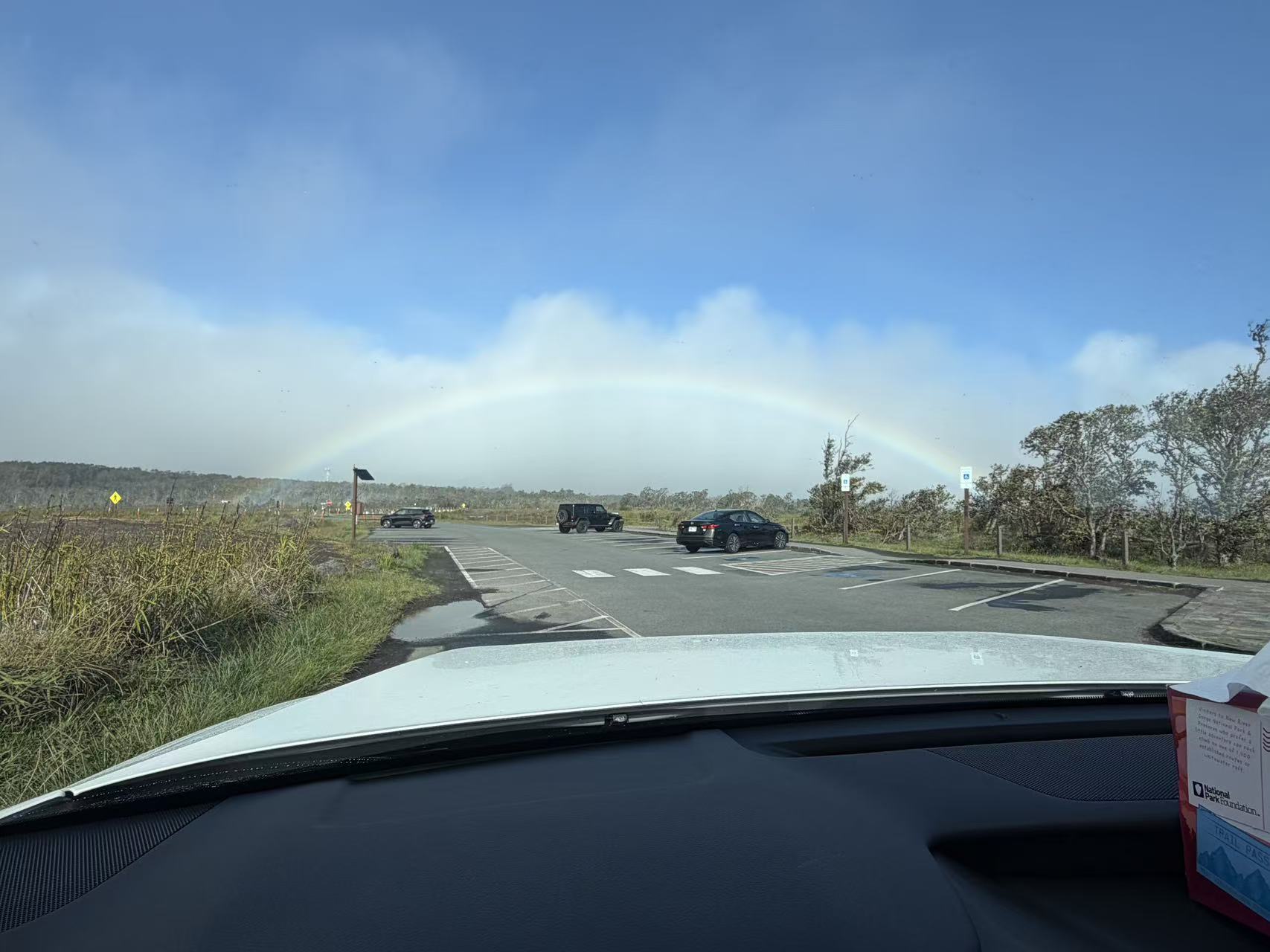Rainbow above a road through Hawaiʻi Volcanoes National Park